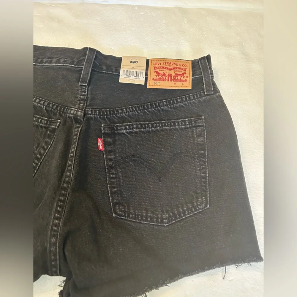 Levi’s NWT black 501 original fit high rise distressed black denim jean shorts